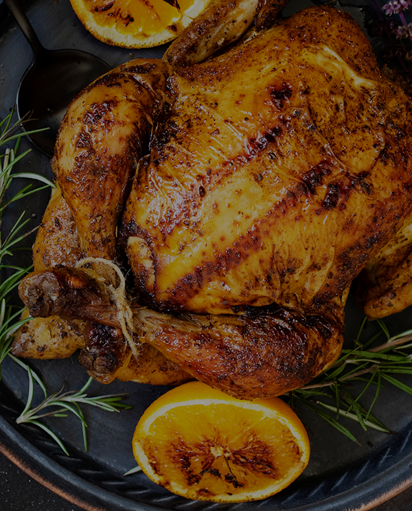 Recette de Poulet rôti à l'orange, ail et thym frais