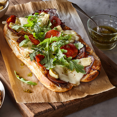 Submarine Sandwiches with Spicy Pepperoni, Caramelized Onion, Artichoke, Roquette and Fresh Mozzarella